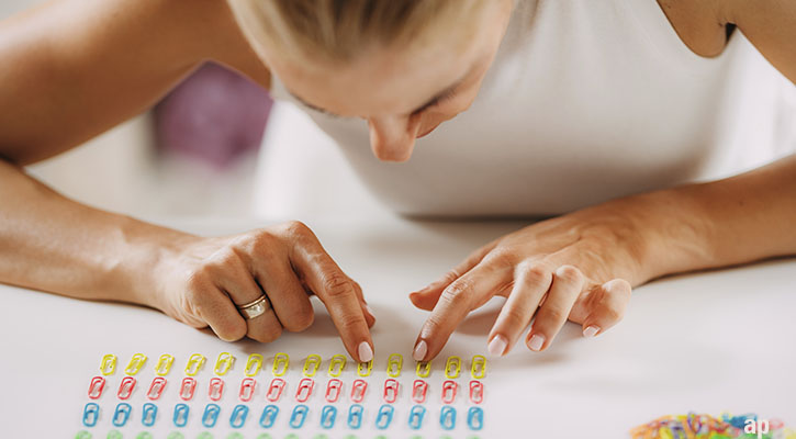 woman sorting paper clips